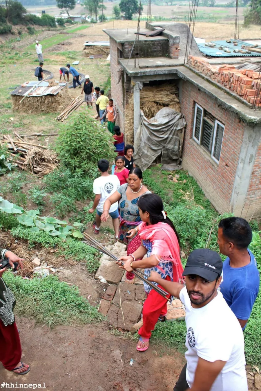 Community members and volunteers working together in Nepal